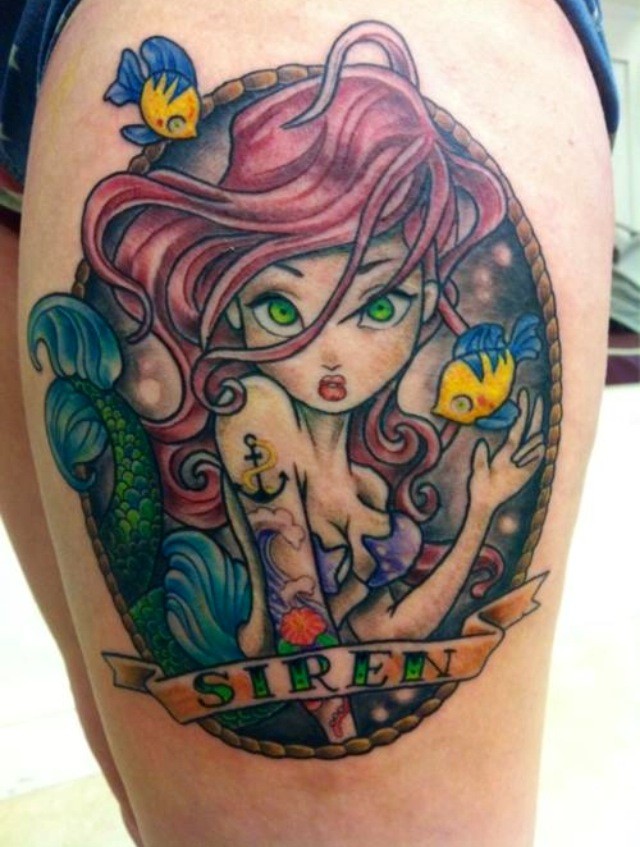 Cartoon style colored thigh tattoo of seductive mermaid with lettering and fishes