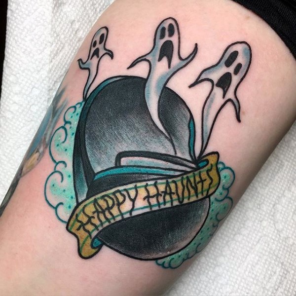 Cartoon style cute looking arm tattoo of ghosts with lettering