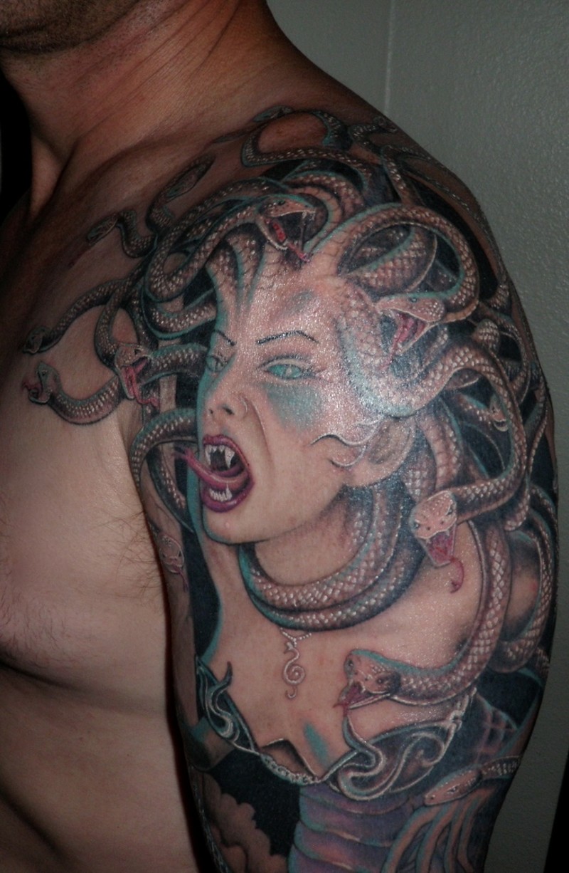 Cartoon style detailed shoulder tattoo of large evil Medusa portrait