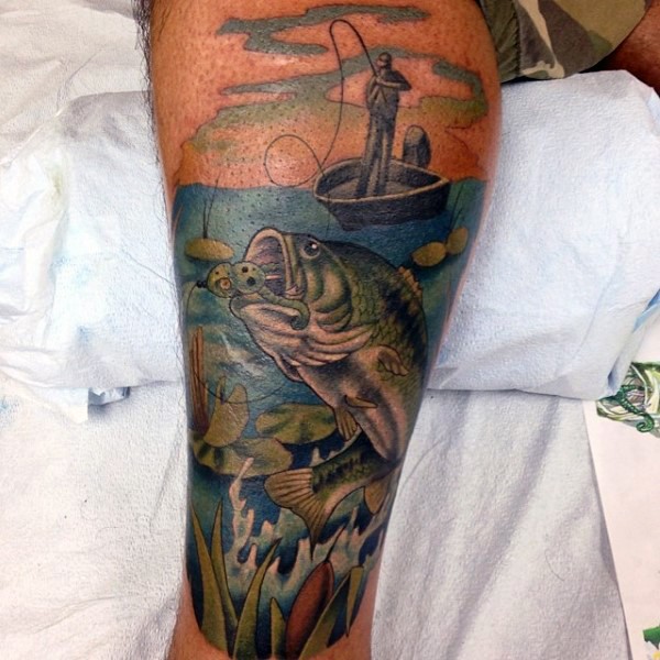Cartoon style painted and colored big hooked fish tattoo on leg