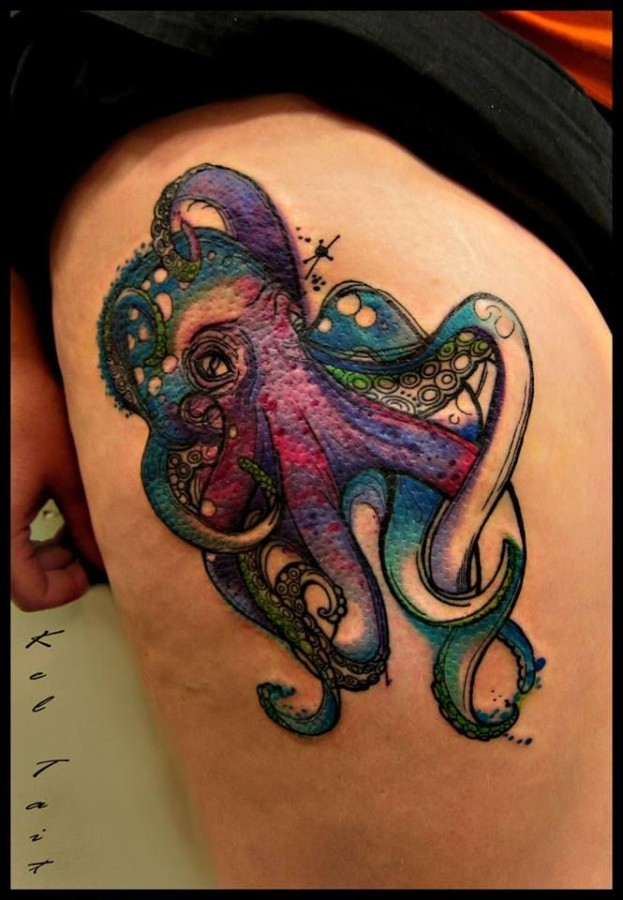 Cartoon style painted multicolored octopus tattoo on thigh