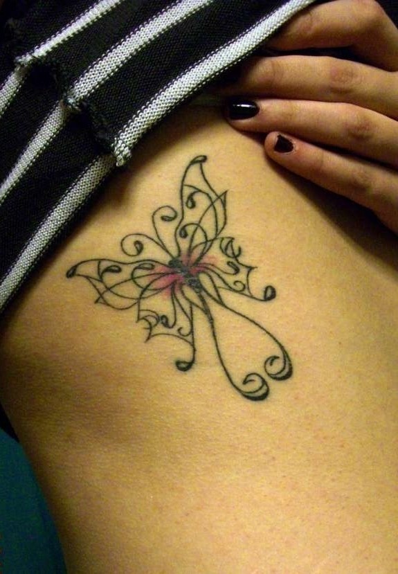 Celtic butterfly tattoo on ribs
