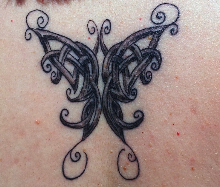 Celtic butterfly tattoo with shadows on back