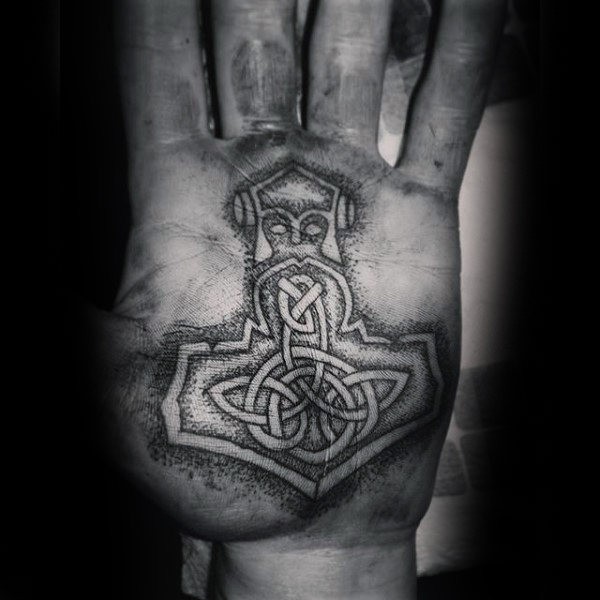 Celtic style black ink hand tattoo of ancient symbol
