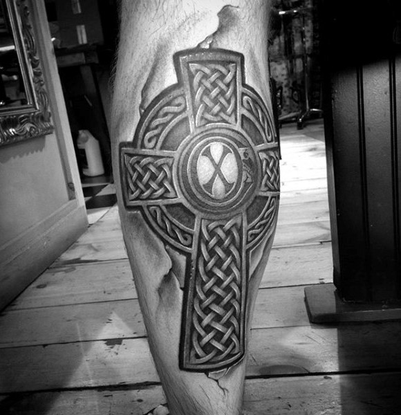 Celtic style black ink leg tattoo of big cross
