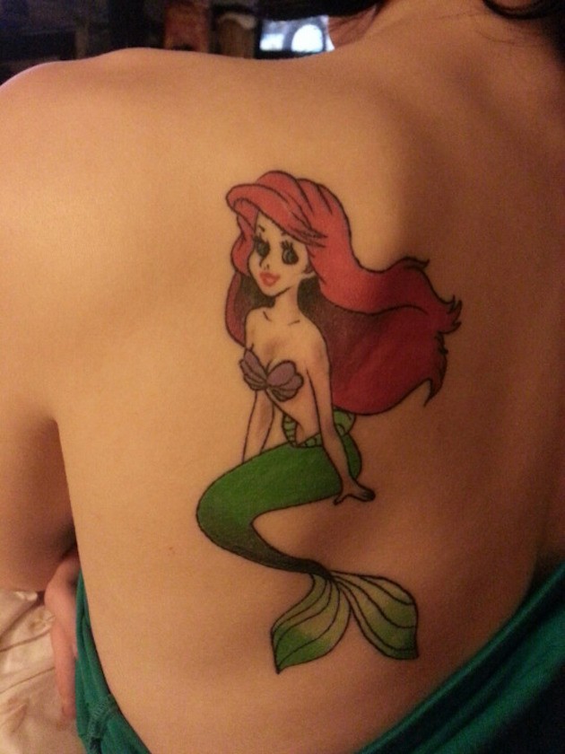 Charming Ariel mermaid traditionally colored tattoo on back