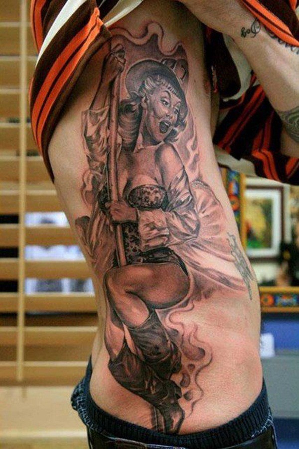 Cheerful cowboy pin up girl tattoo on ribs