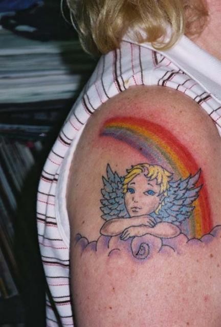 Cherub on a cloud and a rainbow tattoo on shoulder