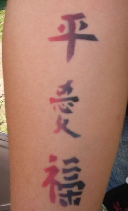 Chinese letters tattoo in red and black colors