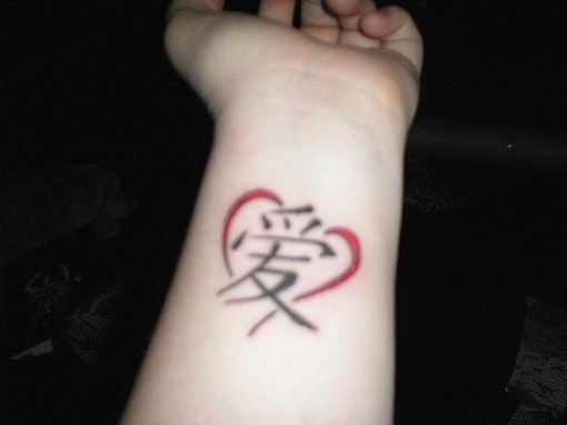 Chinese love tattoo with heart on wrist