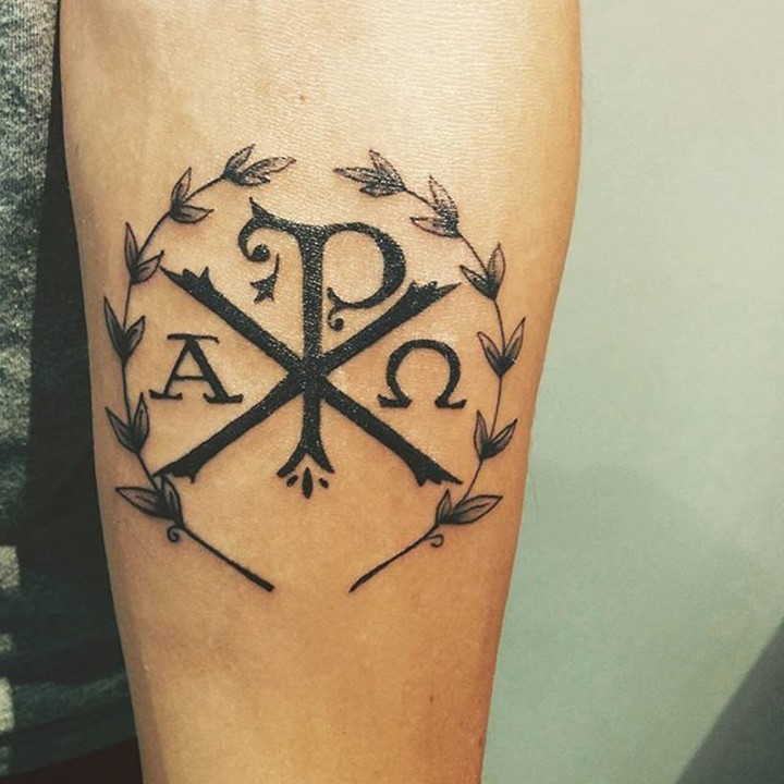 Christ monogram Chi Rho forearm tattoo with Laurel wreath