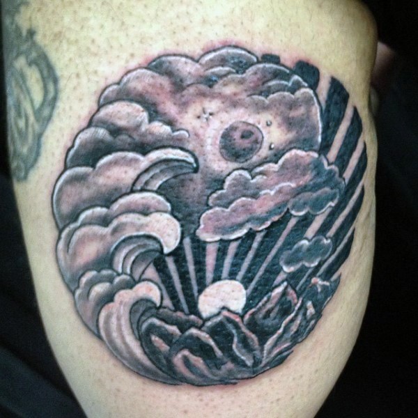 Circle shaped black and gray style night sky tattoo on arm