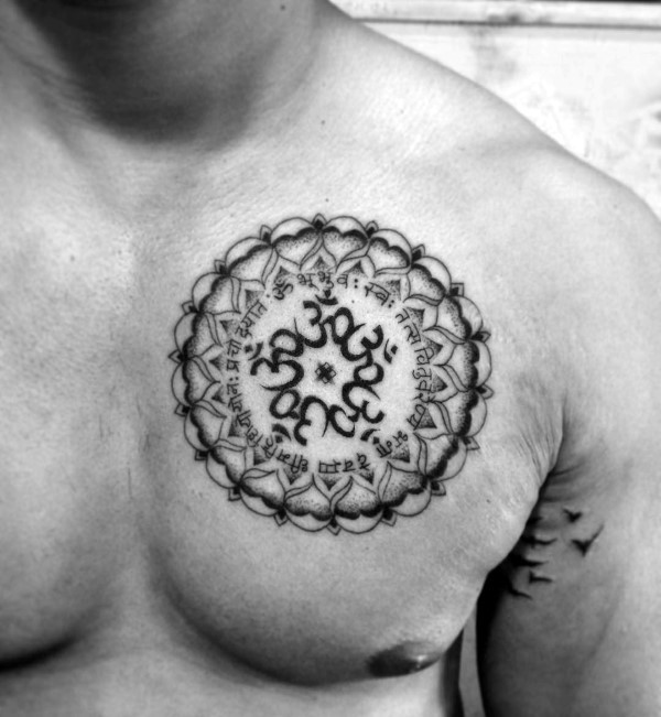 Circle shaped black ink chest tattoo of Hinduism ornament
