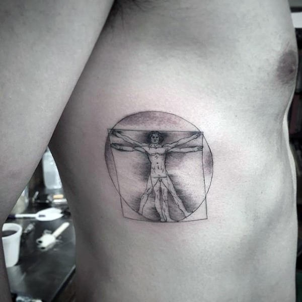 Tatuaje en forma de círculo de tinta negra del hombre de Vitruvio diseñado por Da Vinchi