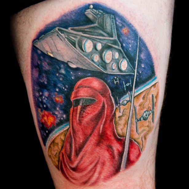 Circle shaped colored thigh tattoo of star wars ship with warrior