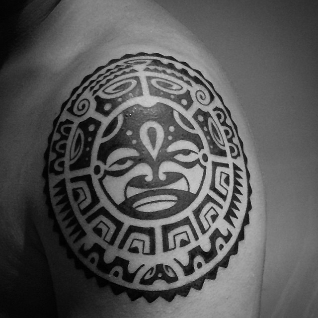 Circle shaped medium size black ink shoulder tattoo of Polynesian ornaments