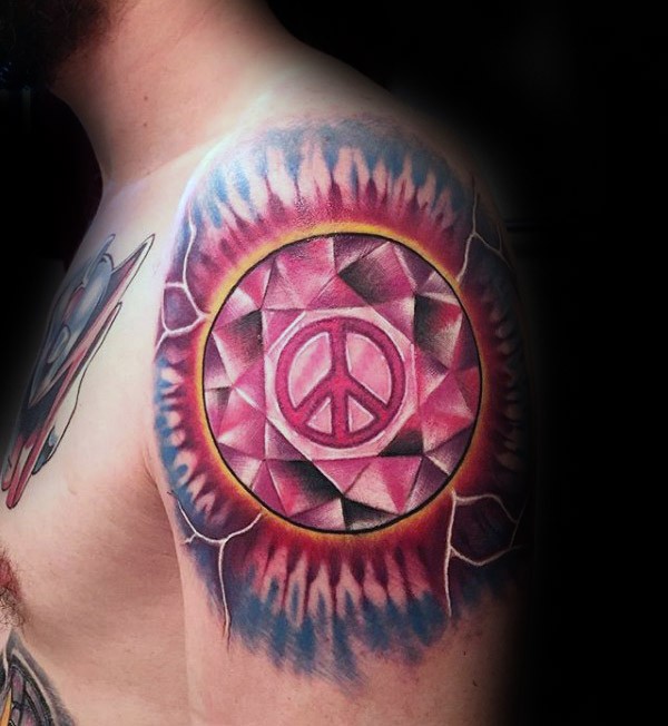 Circle shaped shoulder tattoo of diamond stylized with pacific symbol