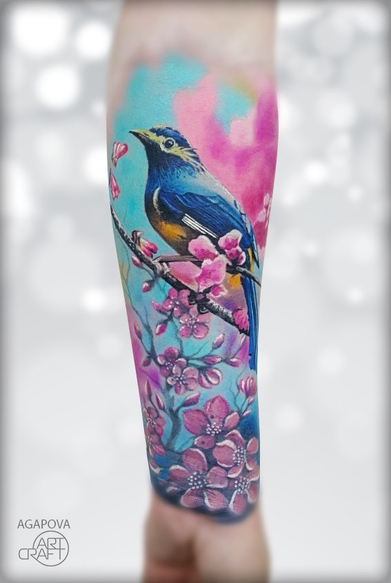 Colofull girly tattoo with bird in flowers