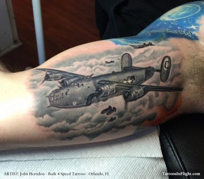 Colored amazing looking biceps tattoo of WW2 bomber planes