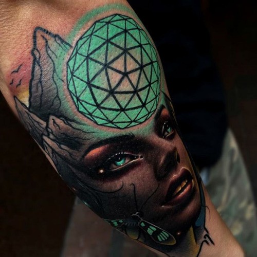 Colored amazing looking forearm tattoo of of mystic woman with magical orb
