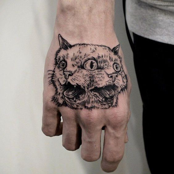 Colored amazing looking hand tattoo of creepy cat