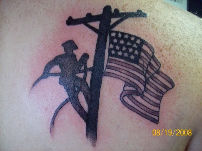 Colored American native scapular tattoo of lineman with flag