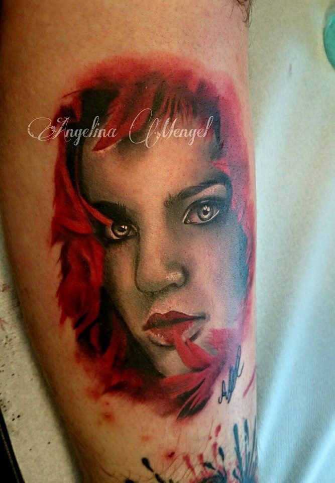 Colored arm tattoo of mystical woman face with red hair