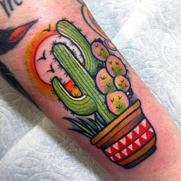 Colored arm tattoo of western style cactus