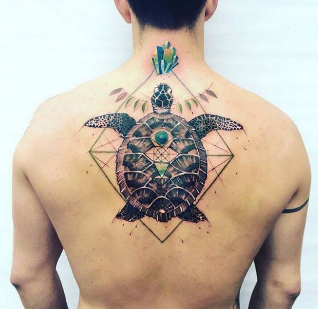 Colored awesome looking colored upper back tattoo of big turtle with ornaments