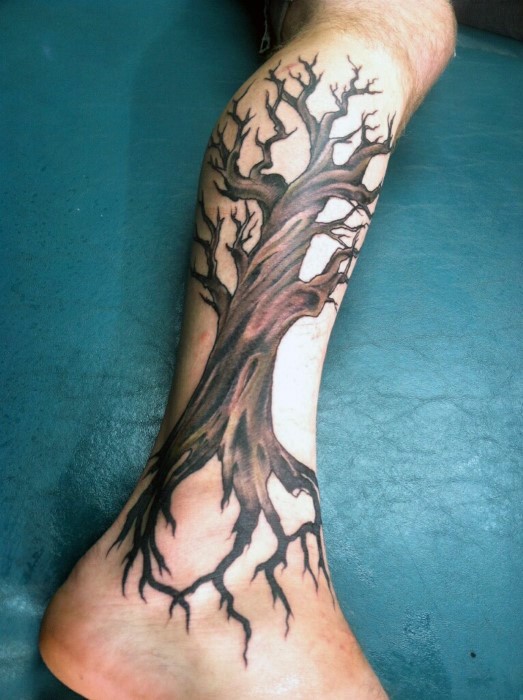 Colored big tree tattoo on leg