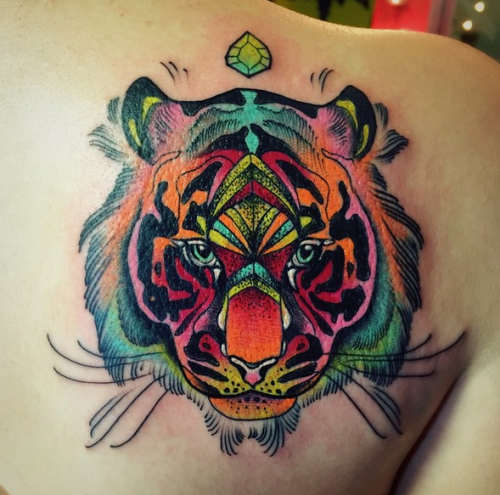 Colored cartoon style scapular tattoo of tiger face