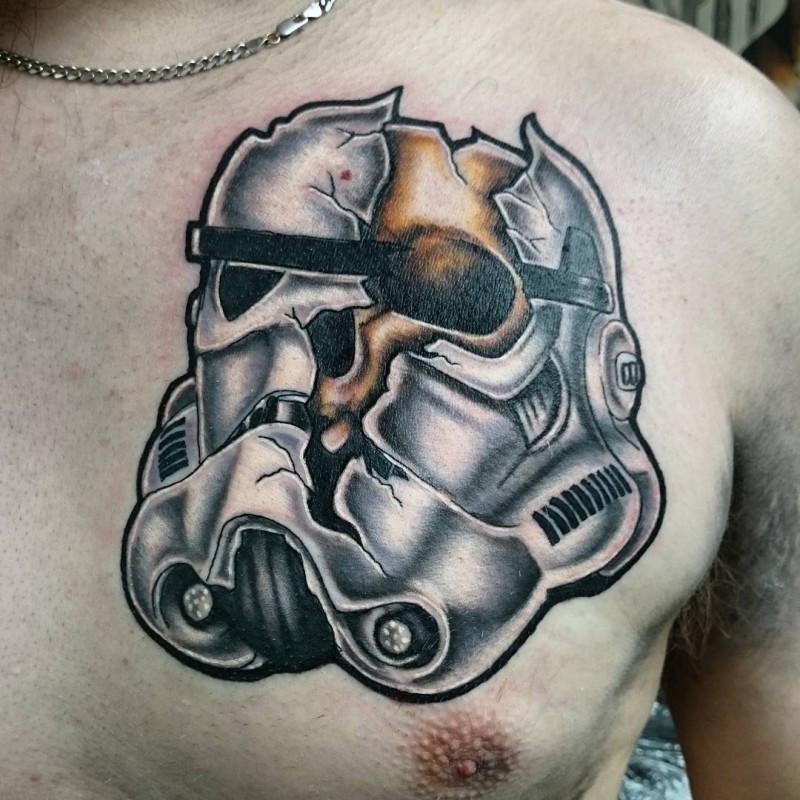 Colored chest tattoo of broken helmet and skull