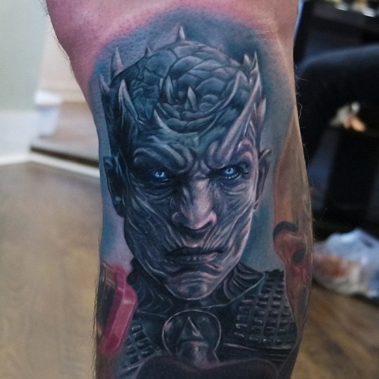 Colored cool looking leg tattoo of demonic warrior