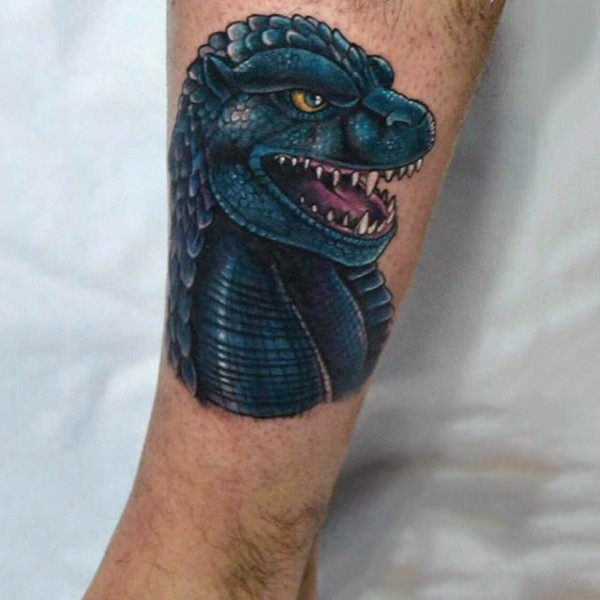 Colored detailed cartoon dinosaur&quots head tattoo on leg
