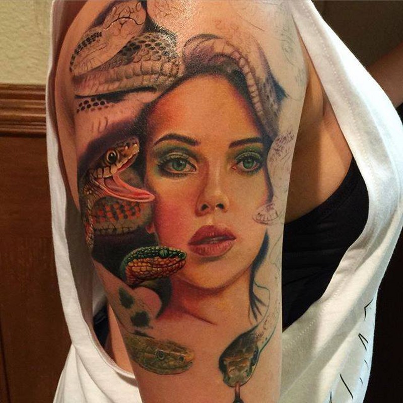 Colored elegant woman portrait tattoo on shoulder with different snakes