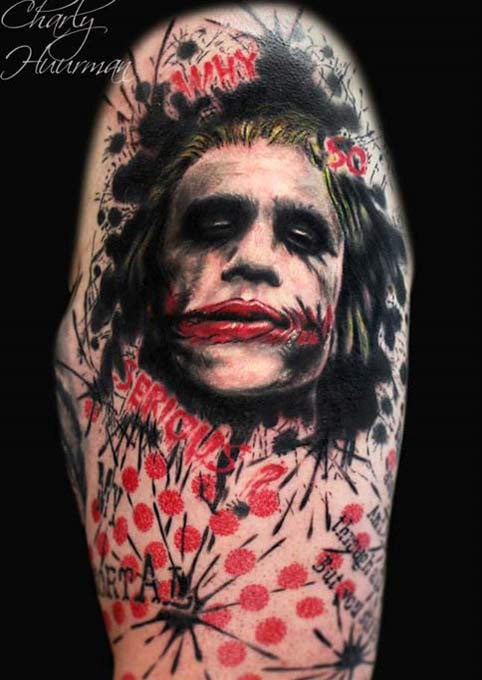 Colored evil Joker face tattoo with lettering