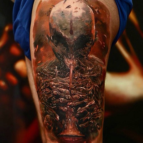 Colored fantasy style thigh tattoo of creepy skeleton monster