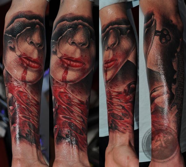 Colored forearm tattoo of creepy woman face with key