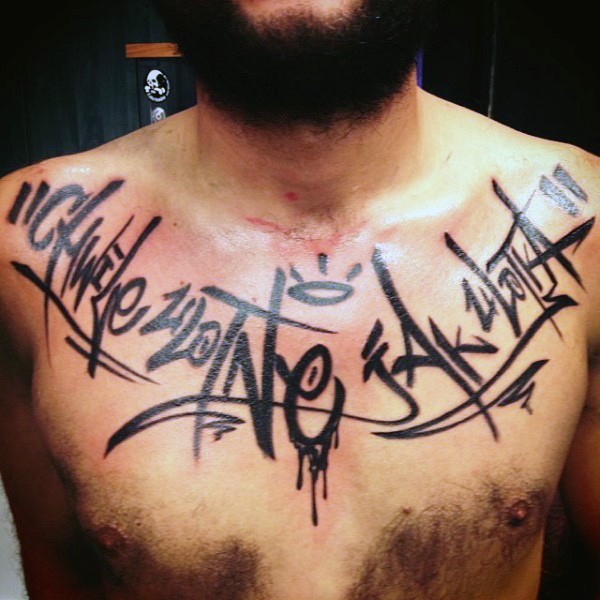Colored graffiti style chest tattoo of big lettering