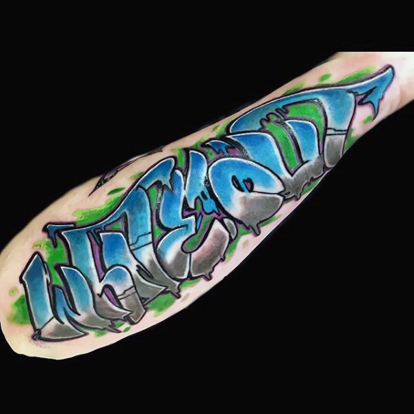 Colored graffiti style tattoo on arm