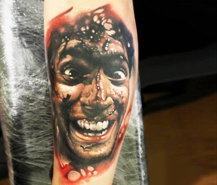 Colored horror style bloody arm tattoo of crazy man