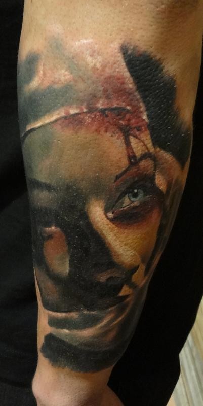 Colored horror style bloody nurse tattoo on forearm