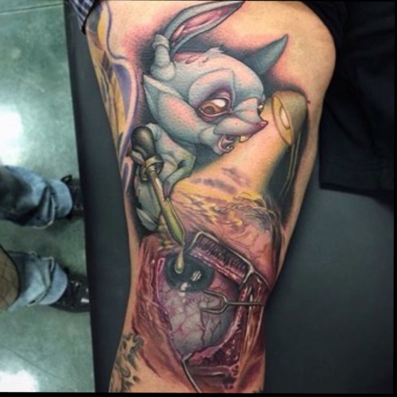 Colored horror style colored thigh tattoo of creepy mouse with human eye