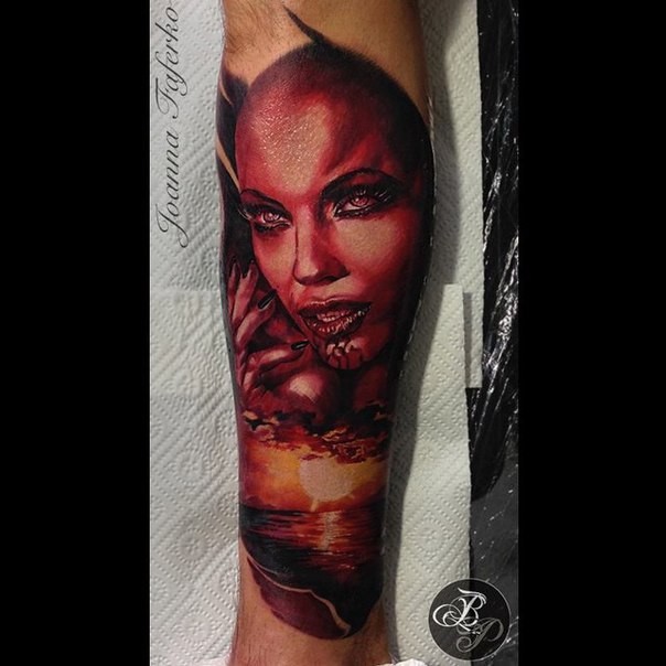 Colored horror style creepy looking arm tattoo of devils woman face