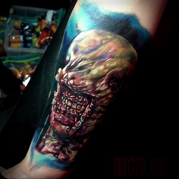 Colored horror style creepy looking arm tattoo of bloody monster