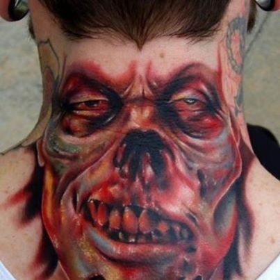 Colored horror style creepy looking neck tattoo of monster face
