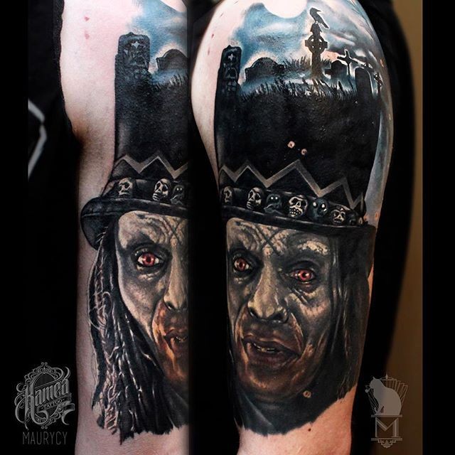 Colored horror style creepy looking shoulder tattoo of demonic man with cemetery shaped hat