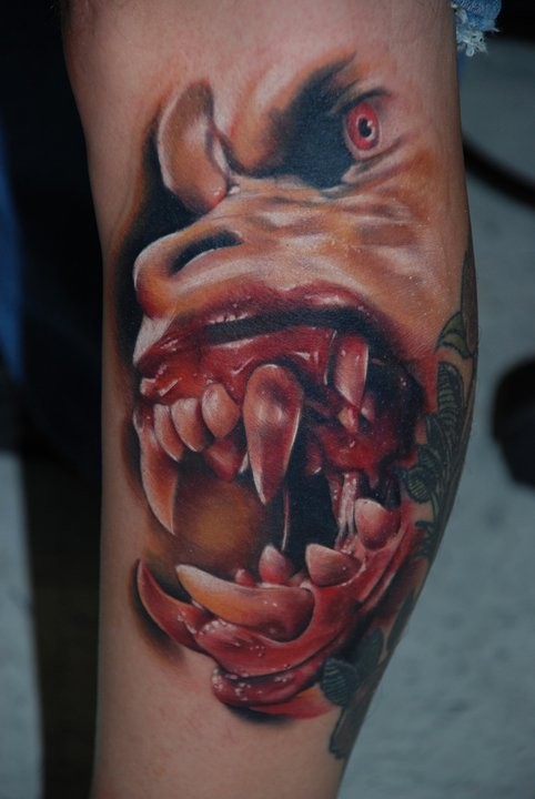 Colored horror style creepy looking tattoo of monster face