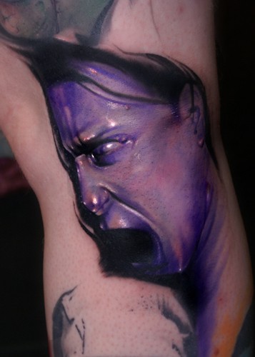 Colored horror style creepy looking woman face tattoo