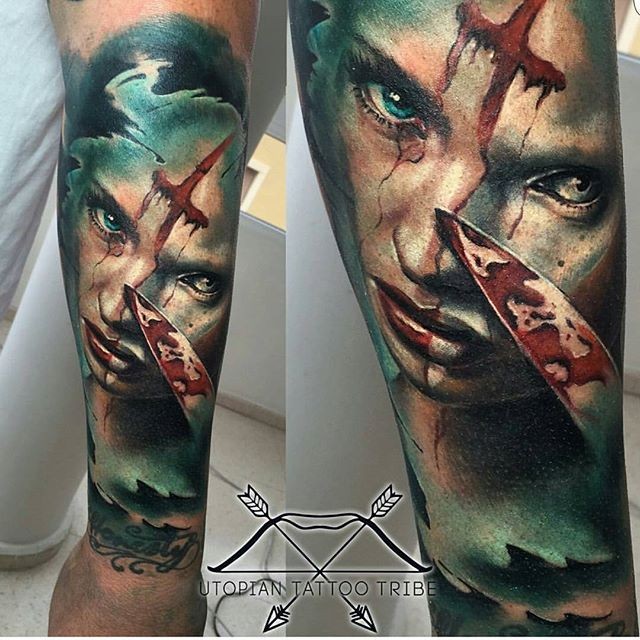 Colored horror style forearm tattoo of bloody woman with knife